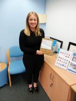Jo Tinson, partner, accepts the Rotary Business of the Month trophy